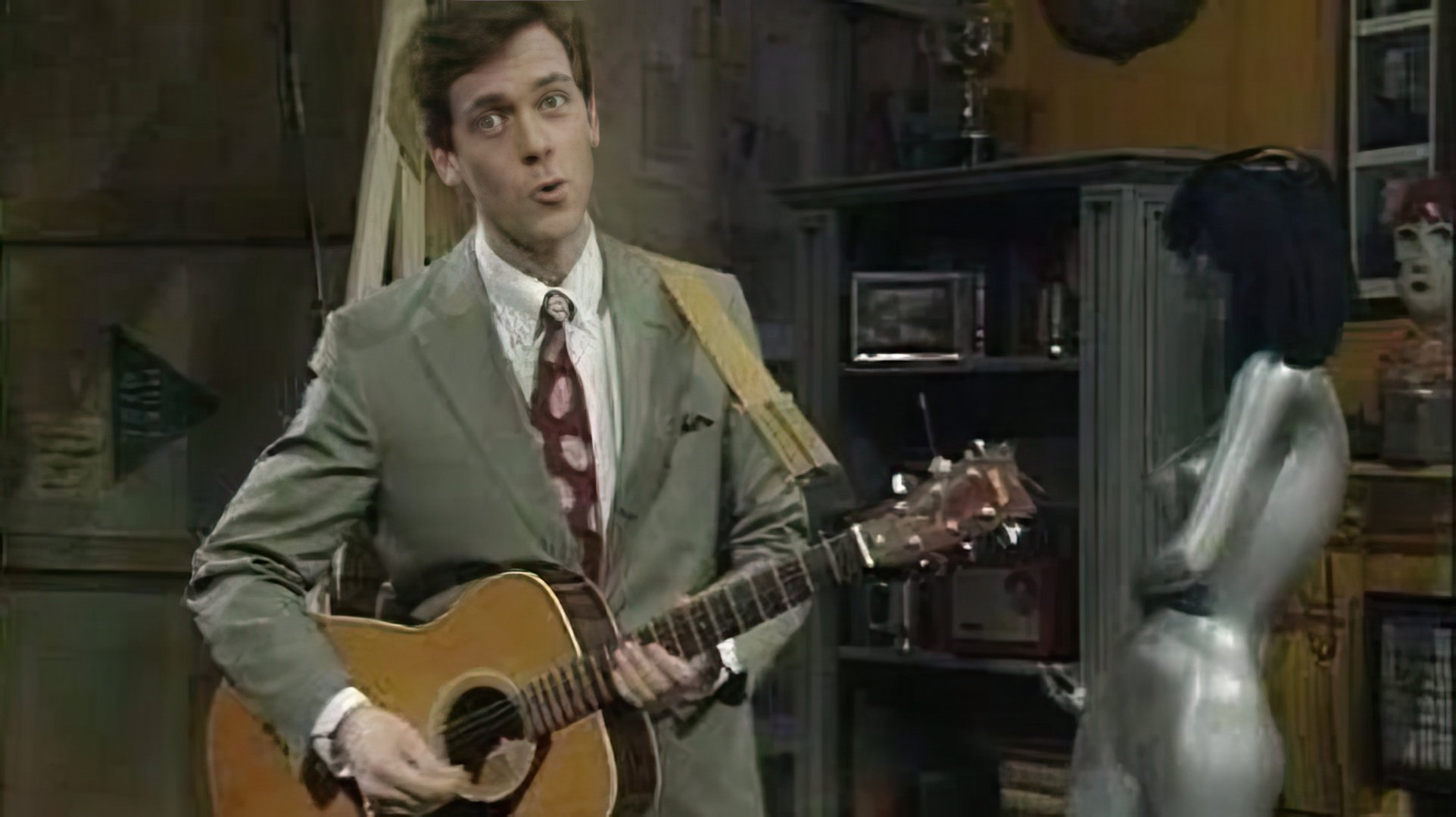Hugh Laurie toca la guitarra, el piano y la armónica de manera excelente