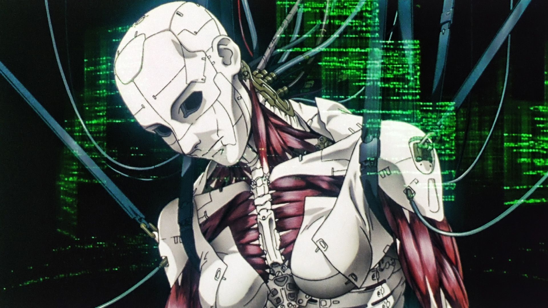 Androide blanco entre cables contra luces verdes en un fotograma del anime "Ghost in the Shell"