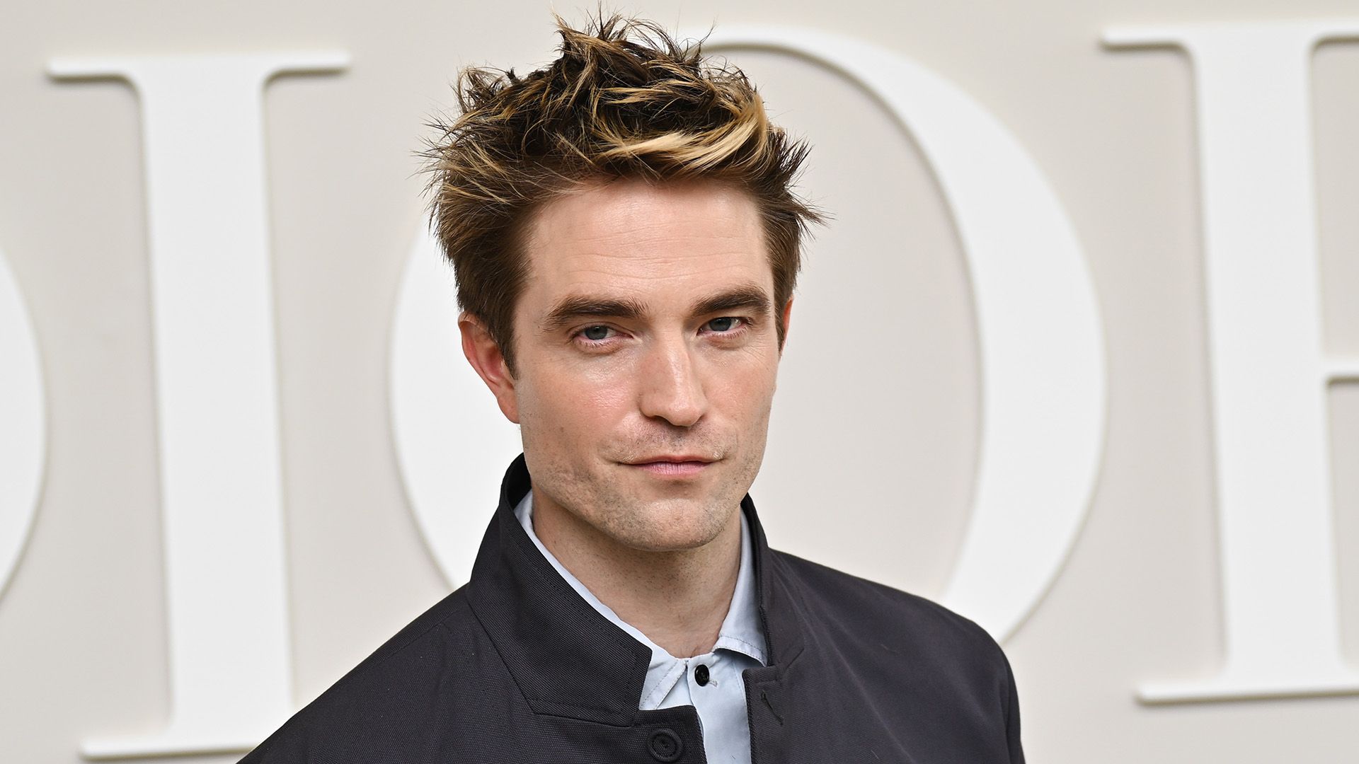 Robert Pattinson close-up on a white background