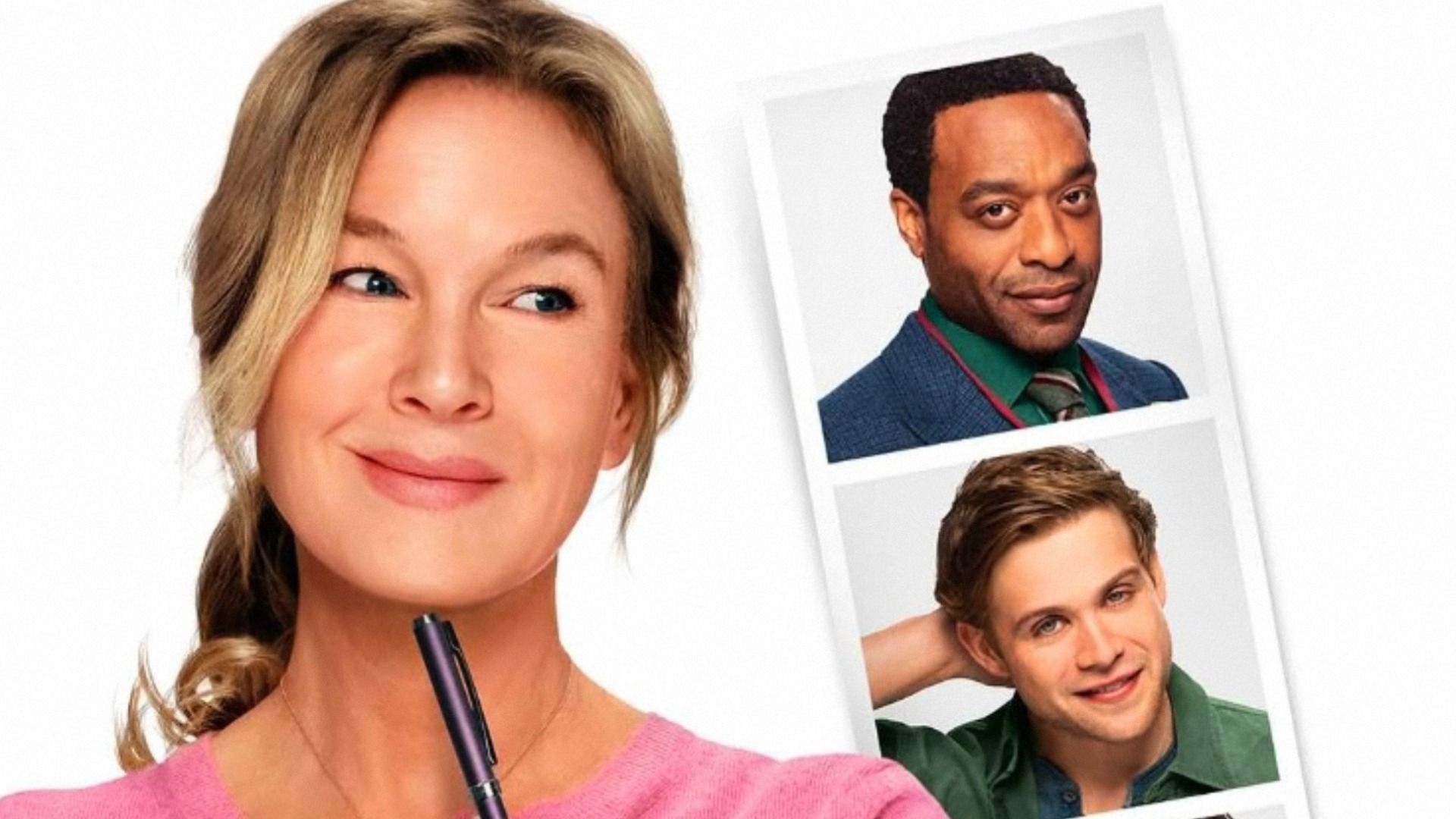 La actriz Renée Zellweger con blusa rosa mira fotografías de dos hombres